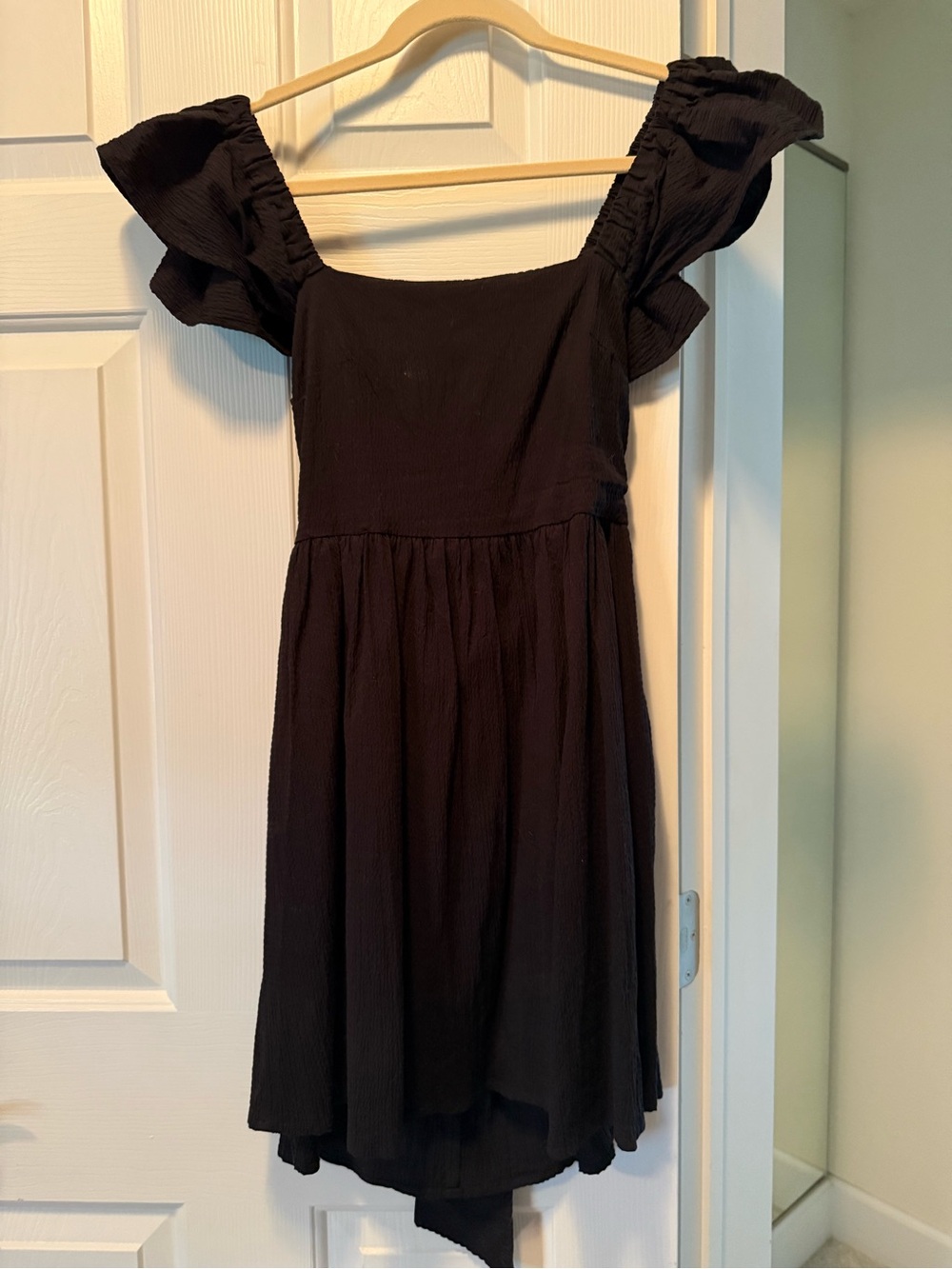 Black Ruffle-Sleeve Mini Dress square front, open back with tie, pockets